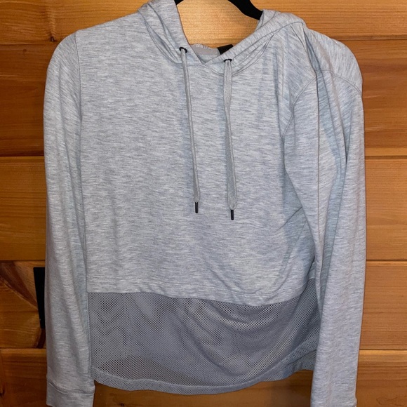 Like new cropped sweatshirt mesh material on bottom half. - Picture 4 of 6